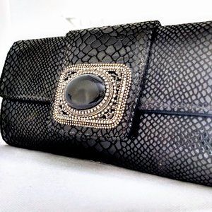 Todd Anthony Leather Clutch in an embossed black croc print. Day to evening!